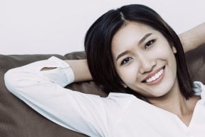 A woman is happy after teeth whitening in Chelsea MA.